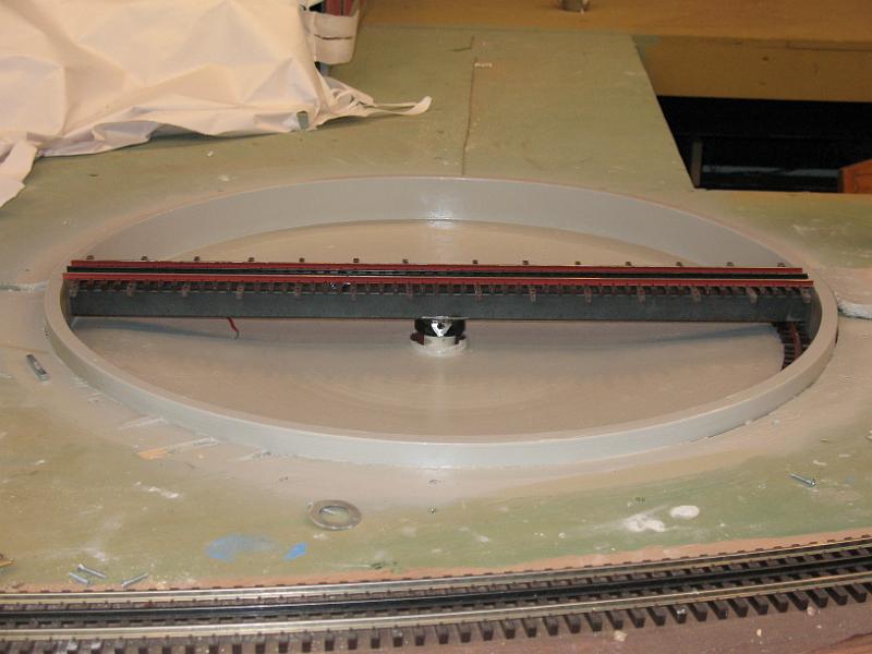 IMG_0018.jpg - The deck (steel channel) with rail and ties is tested for clearances. No commercial kit was available for a turntable of this size and type.