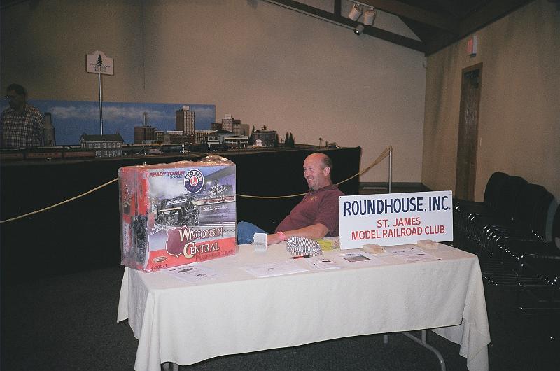 60680024.JPG - Bill trying to peddle the Lionel train set