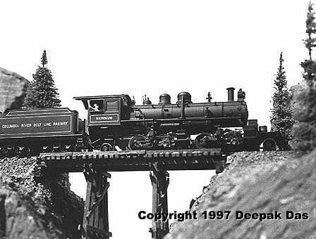 bridge.jpg - A branchline locomotive eases over a spindly trestle.