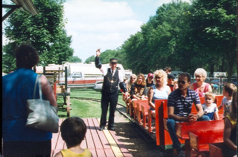 scan0024.jpg - Bill Lenzen "conducting" the live steamer at the Butterfield Threshing Bee