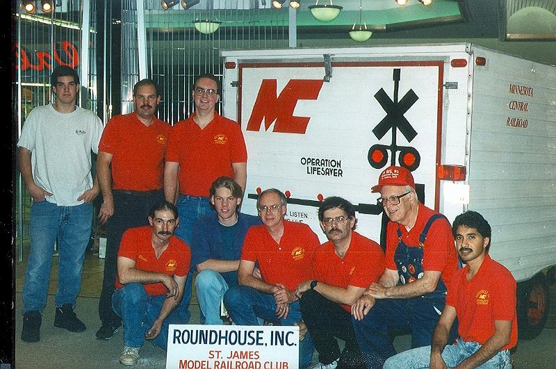 scan0026.jpg - The trailer used to haul the HO scale portable layout.Top row (L to R): Alan, Chuck and DanBottom Row (L to R): Dennis, Shaun, Dale, Wally, Bill Nordgren and Dee