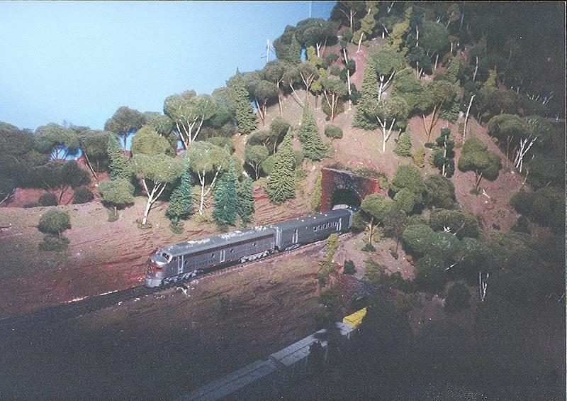 scan0038.jpg - A Chicago, Burlington and Quincy E-unit exits a tunnel with the "Zephyr" in tow.